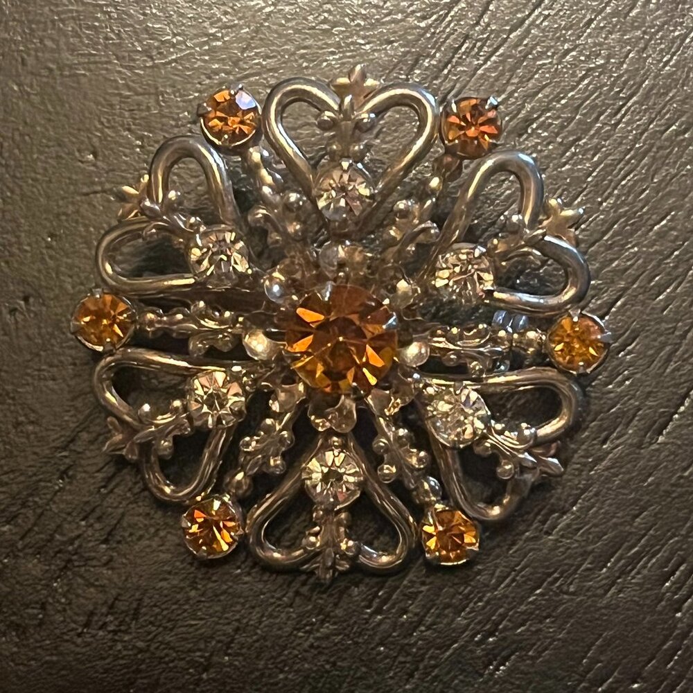 Vintage Gold Tone Starburst Brooch with Amber Topaz and Clear Rhinestones